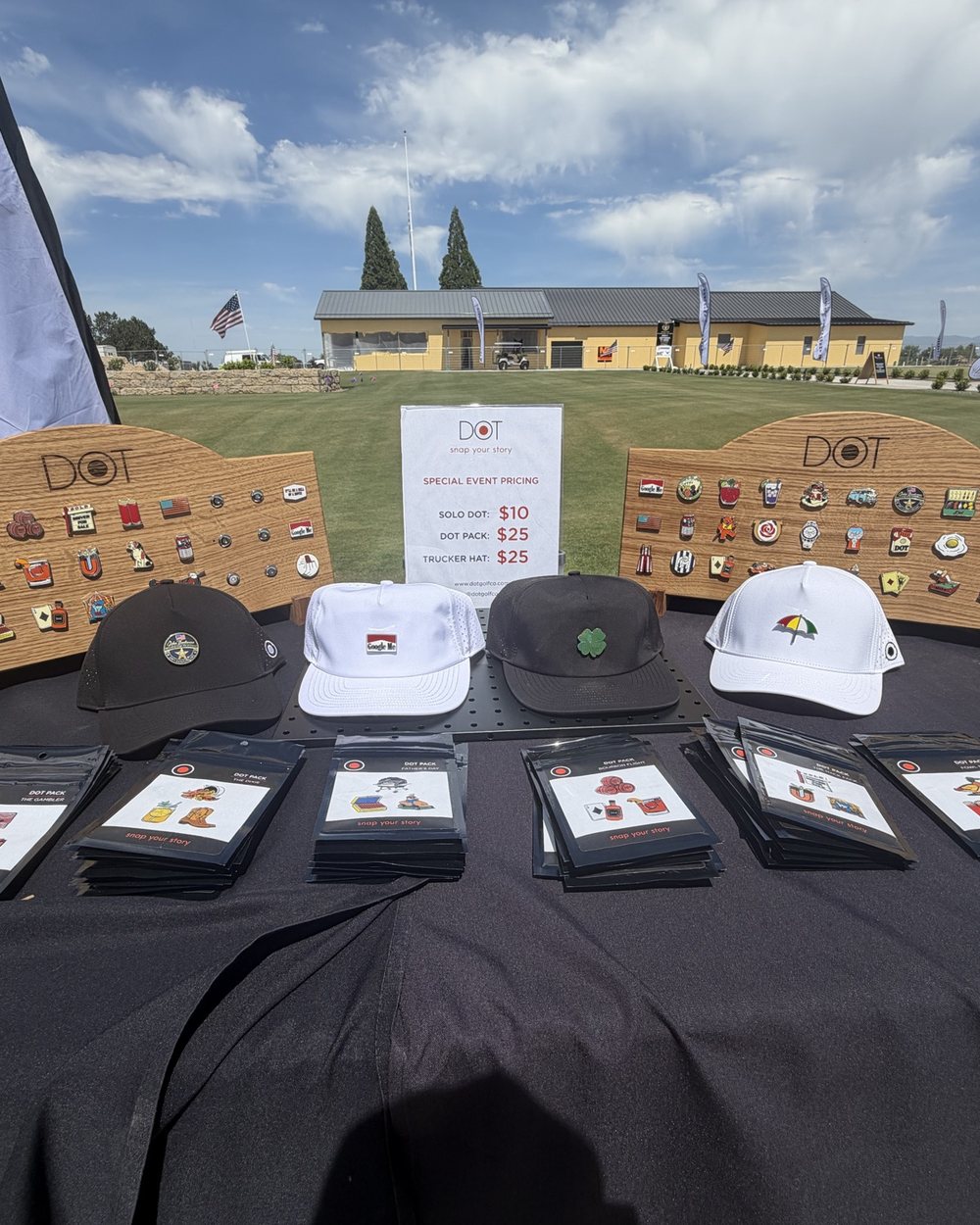 An outing table set with hats and logos